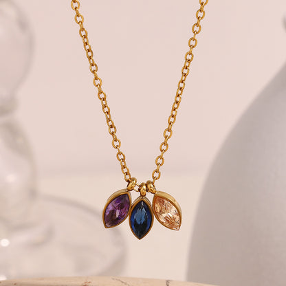 Elegant gold chain necklace featuring three colorful navette-cut stones