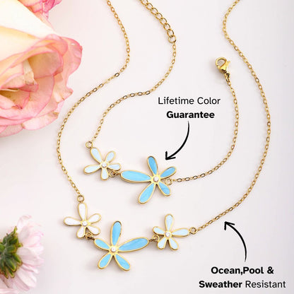Blue and white enamel flower pendant necklaces styled with pastel roses