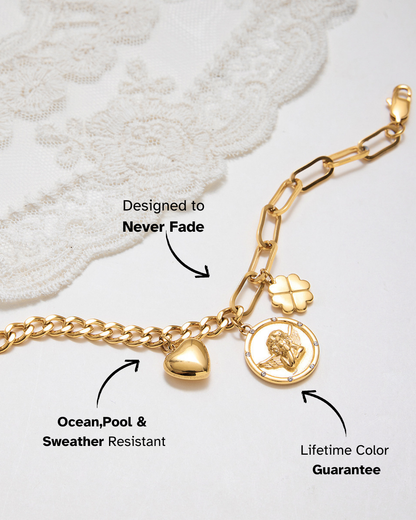 Gold bracelet with charms on a white background