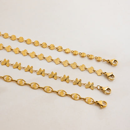 Flat lay of gold butterfly chain necklace with lobster clasp