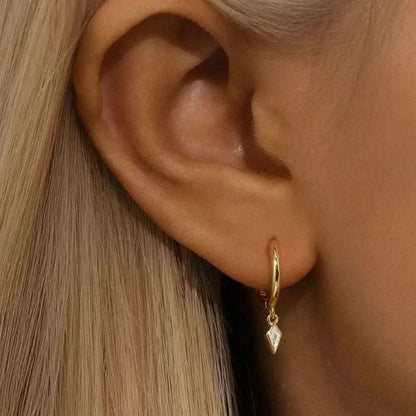 Delicate yet striking, these hoops feature a timeless charm that adds elegance to your daily look.