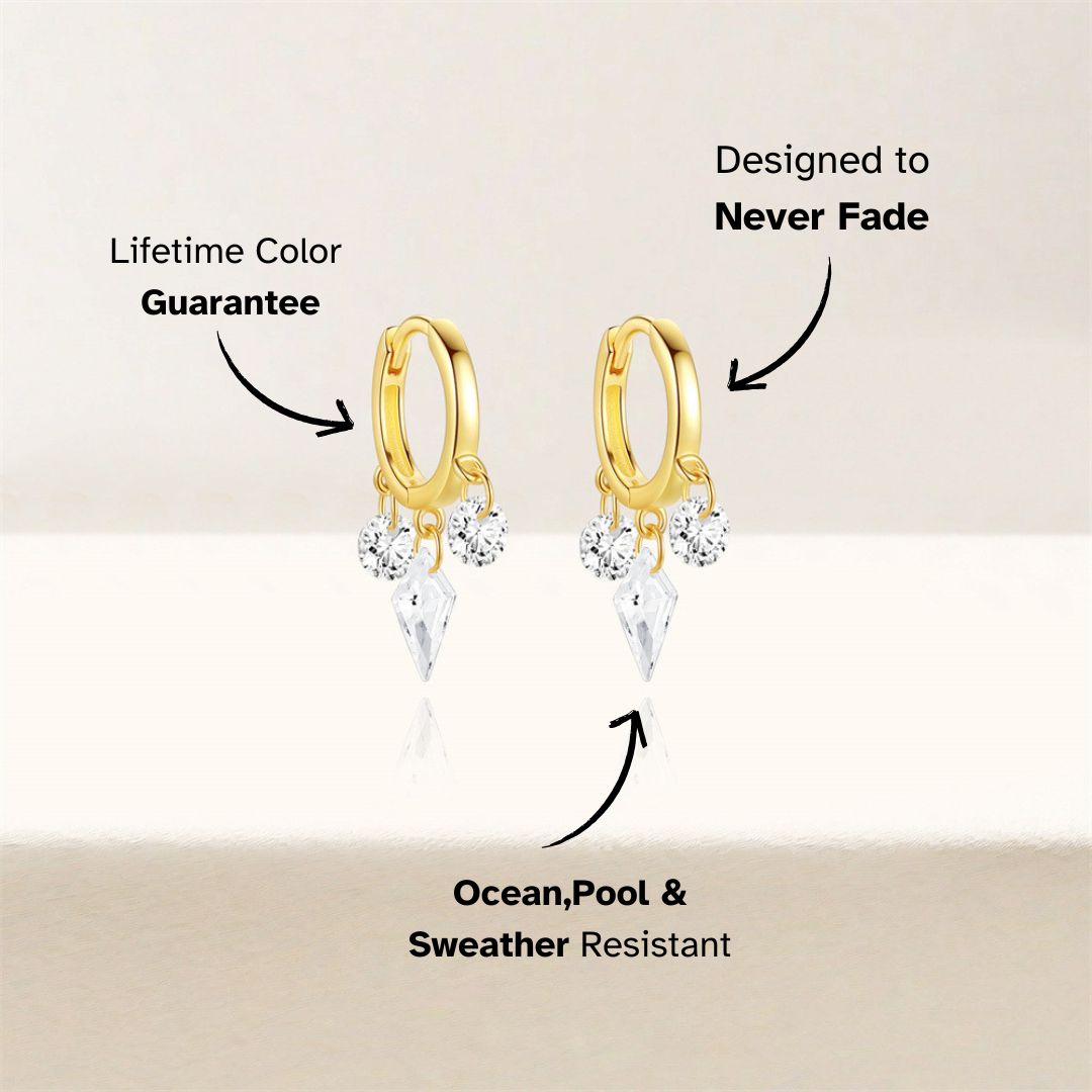 Diamond-cut zircon huggies with gold hoops and minimalistic styling, studio white setup