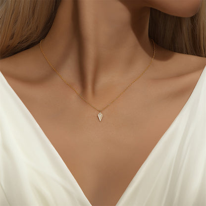 Model showcasing a stunning diamond-shaped zircon pendant necklace in gold.