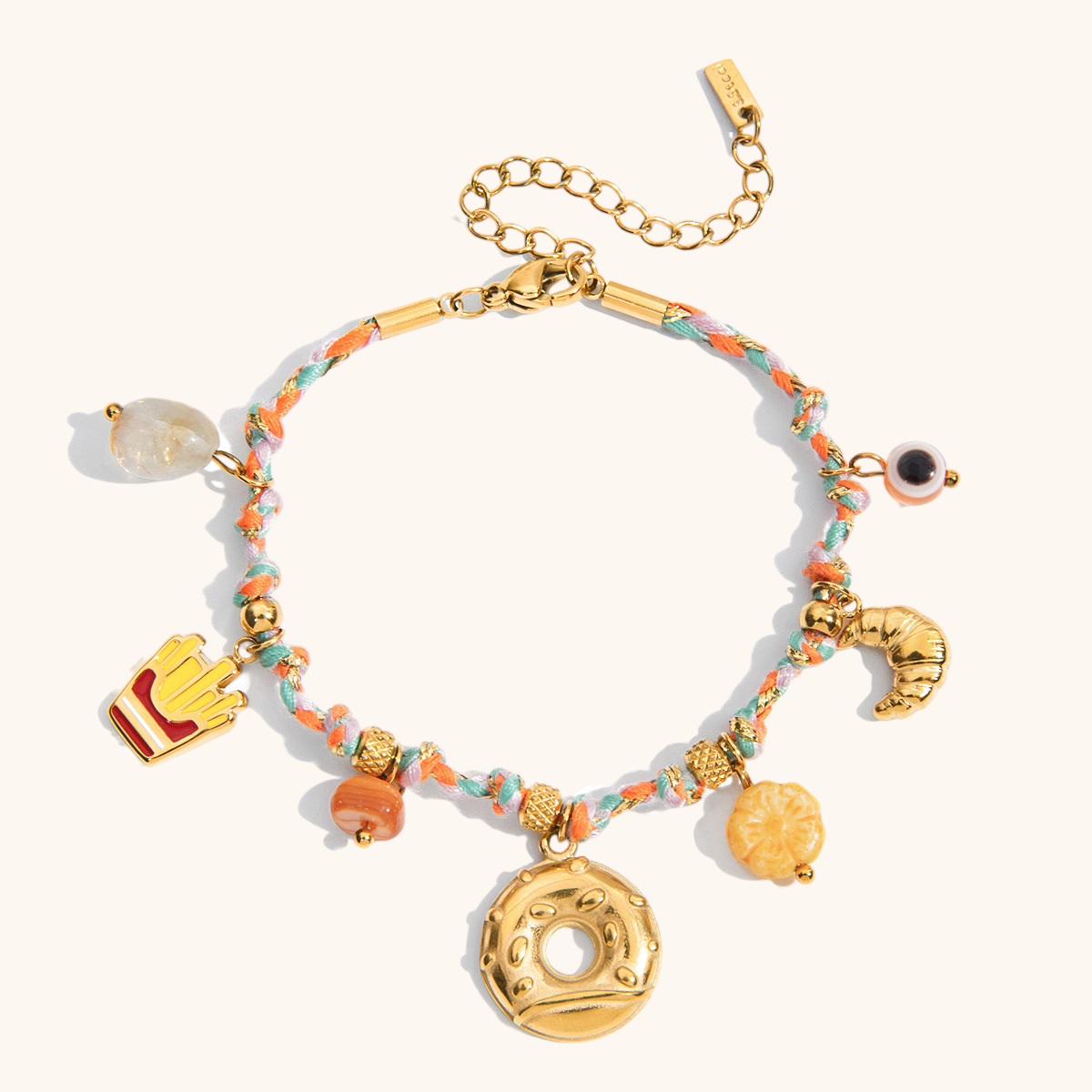 Colorful braided bracelet with donut and croissant charms