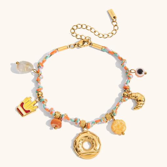 Colorful braided bracelet with donut and croissant charms