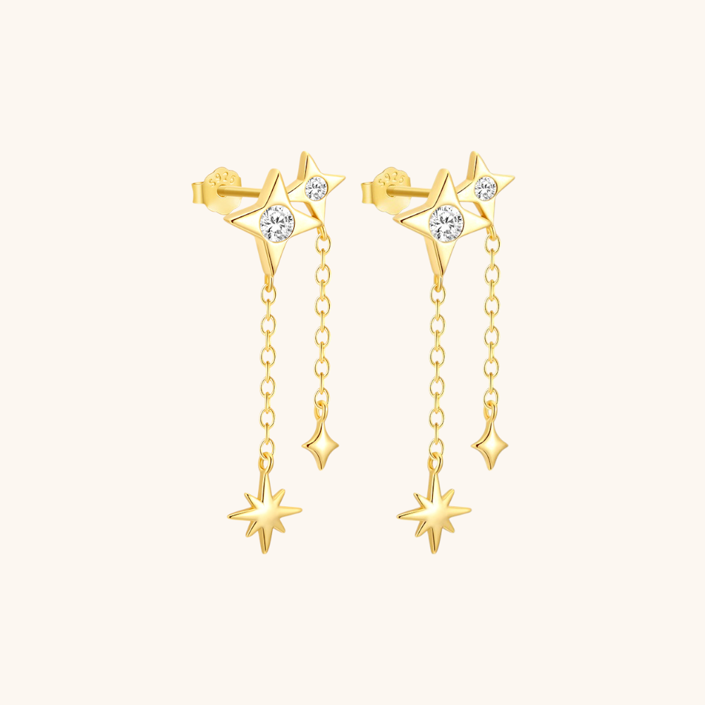 High-resolution image of twin star earrings with dangling charms, elegant and refined.