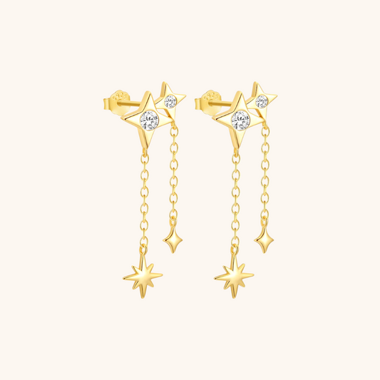 High-resolution image of twin star earrings with dangling charms, elegant and refined.