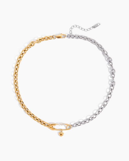 Two chain necklaces, one gold and one silver, on a white background.