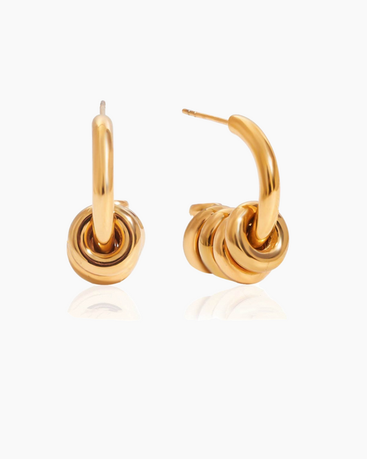 Gold hoop earrings on a white background