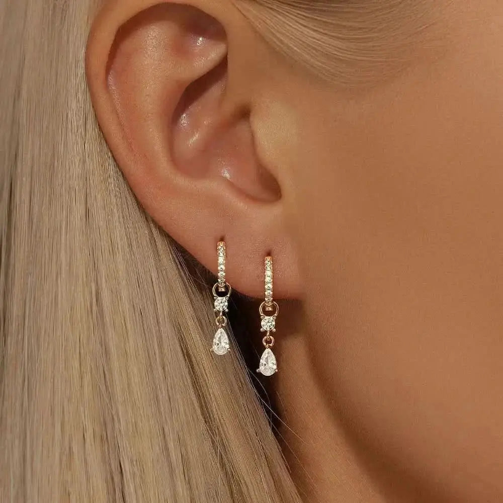 Effortlessly chic, these gold teardrop hoop earrings are perfect for adding sparkle to any outfit.