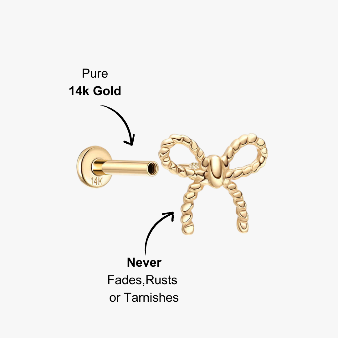 Gold bow stud earring in 14K with rope texture.