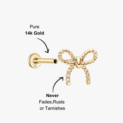 Gold bow stud earring in 14K with rope texture.