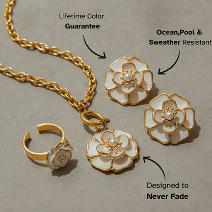 Studio shot of round white enamel and pearl floral earrings with gold outline