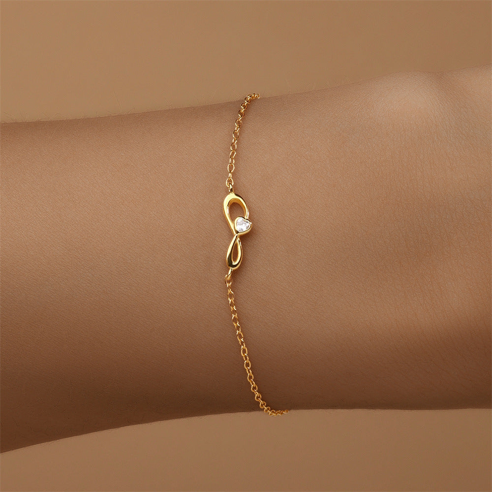 Gold-plated S925 Sterling Silver Infinity Bracelet with zirconia detailing on a wrist