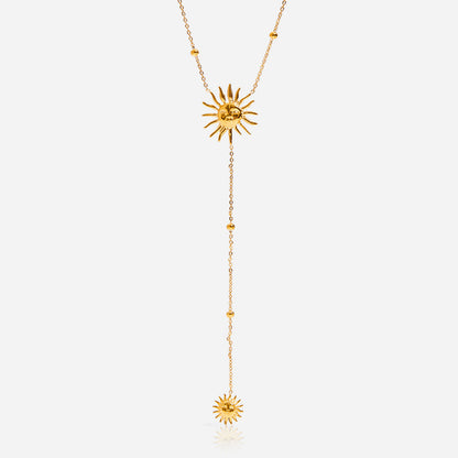 Gold necklace with sunflower pendants on a white background