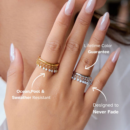 Hand wearing gold and silver rings for trendy layered look