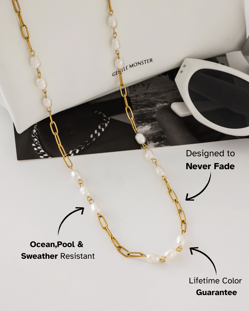 Gold chain necklace with pearls on a magazine background, featuring text about product features.