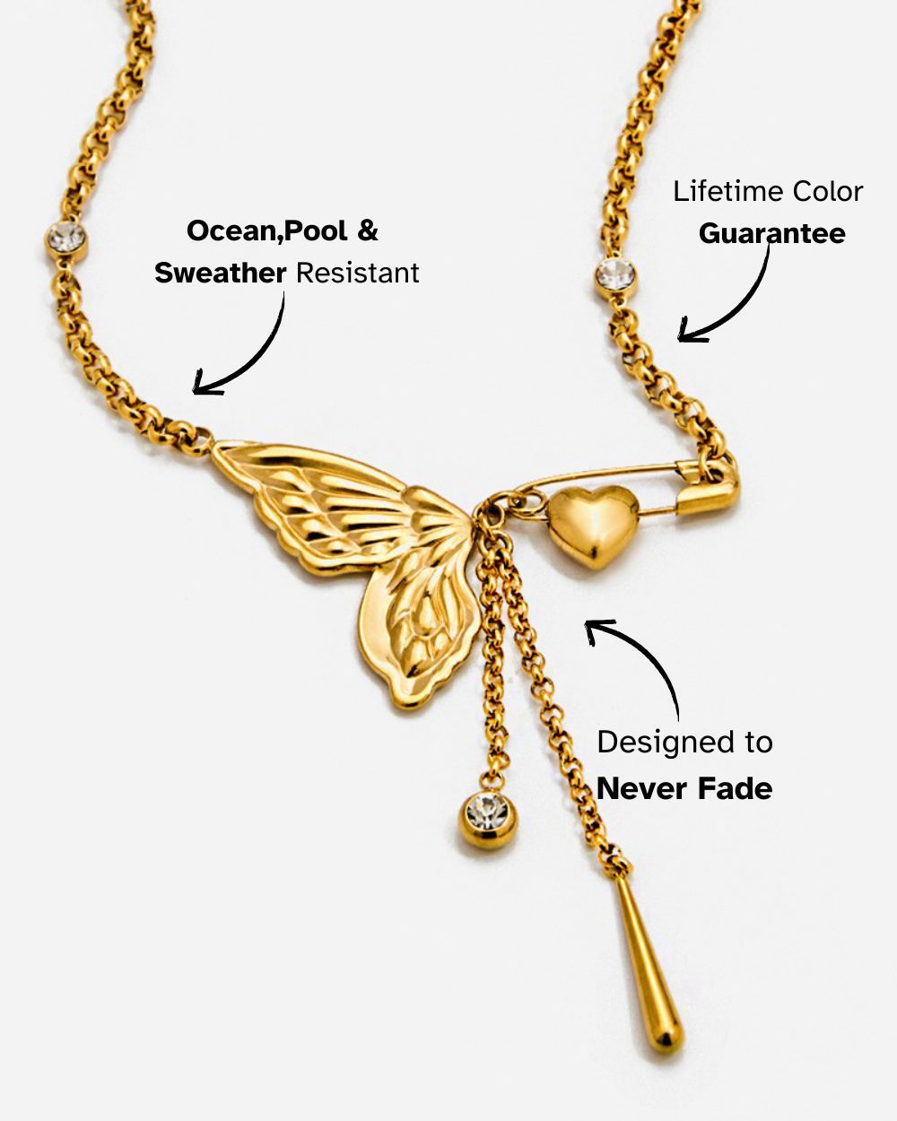 Gold necklace with butterfly and heart pendants on a white background