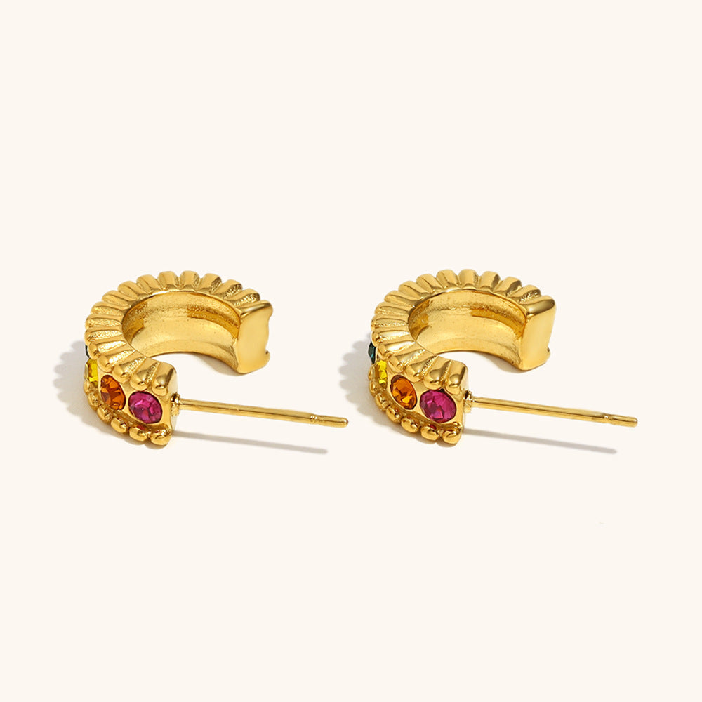 Bold festival-ready hoop earrings with colorful gemstones and textured edges