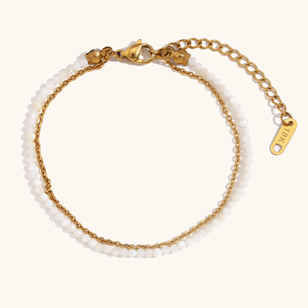 Minimalist double chain bracelet with white frosted crystals and 18K gold clasp.