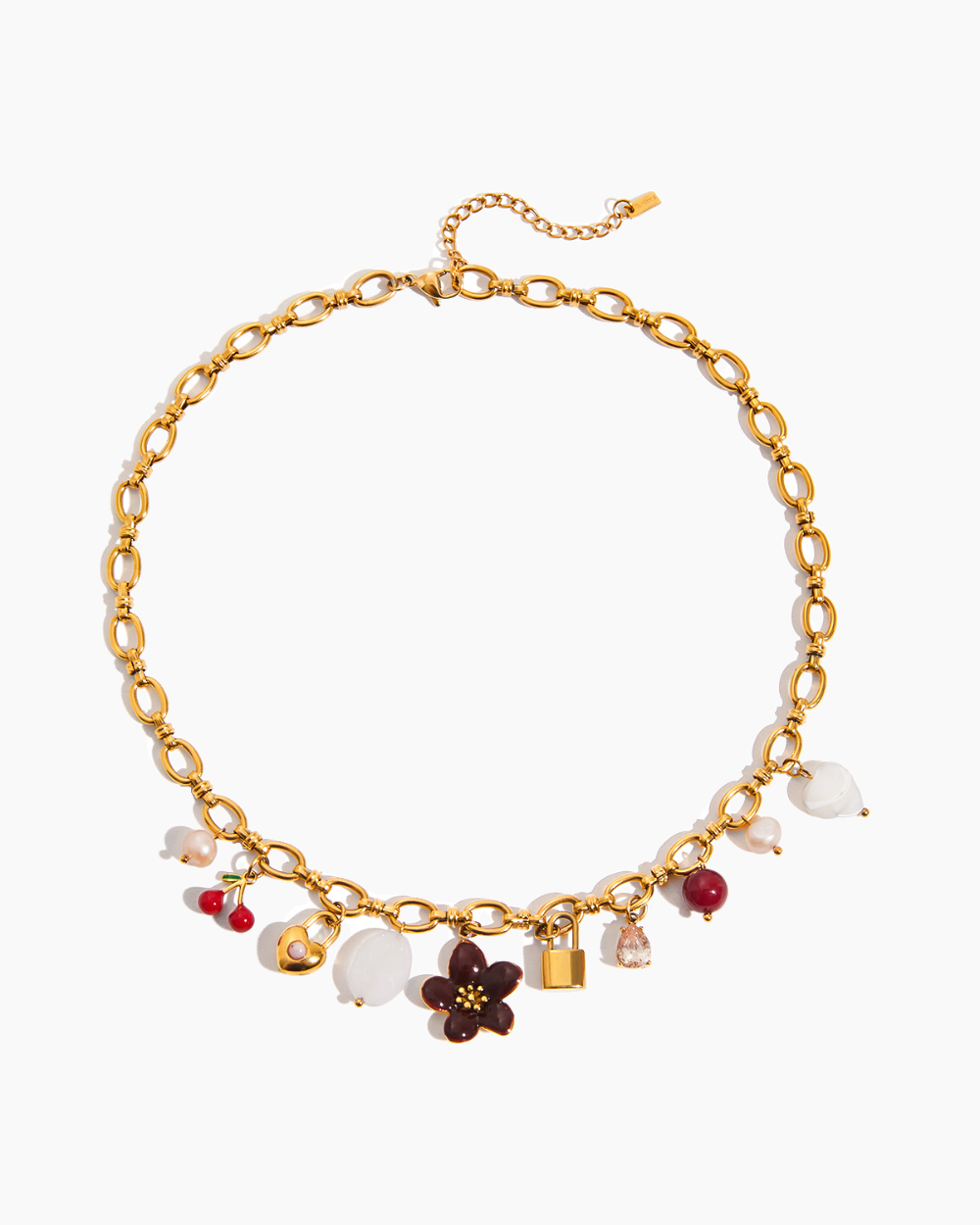 Gold necklace with various charms on a white background