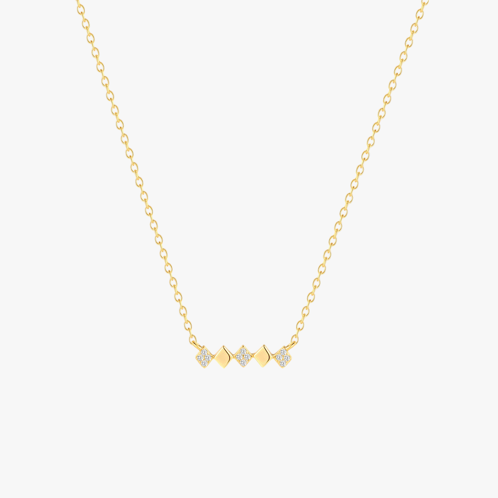 925 sterling silver geometric bar necklace with gold plating and cubic zirconia stones.