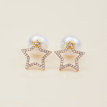 Elegant crystal star earrings styled with ear cuffs and blue gem studs