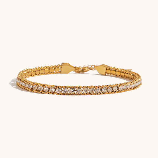  Crystal tennis bracelet laid flat on cream background showing polished stones.