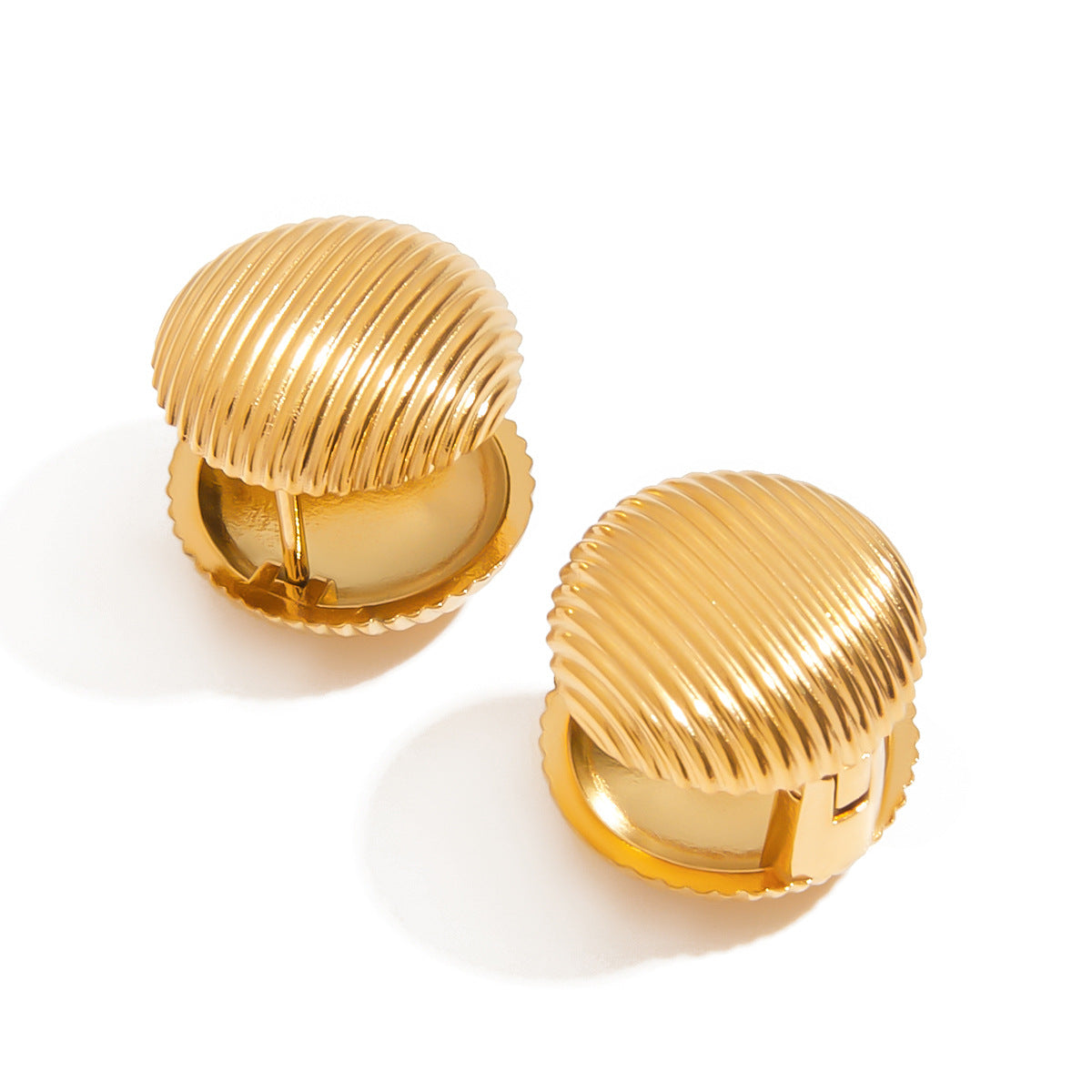 Back view of gold dome clip-on earrings with secure closure, shiny metal detailing