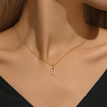 Close-up of gold-plated S925 sterling silver necklace with zirconia pendant on a model