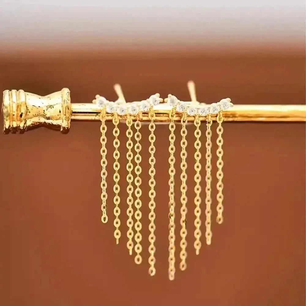 Gold Chain Fringe Earrings – The perfect statement piece, these fringe earrings boast shimmering gold chains and brilliant stones for a dazzling effect.