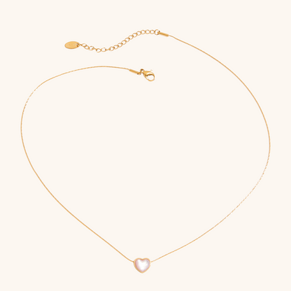 Full necklace layout with adjustable clasp and cat eye heart pendant