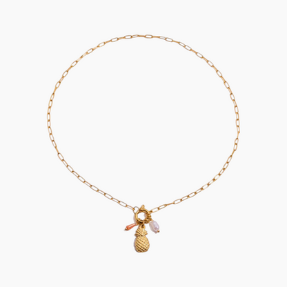 Gold necklace with pineapple charm on a white background