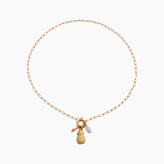Gold necklace with pineapple charm on a white background