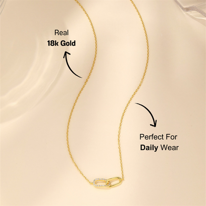 Close-up of the gold crossover zirconia bracelet, highlighted with sparkling zirconia stones.