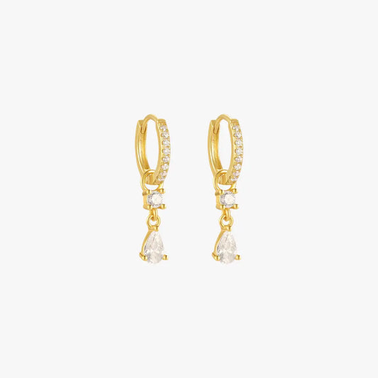 A pair of gold hoop earrings with teardrop charms, set with diamonds.