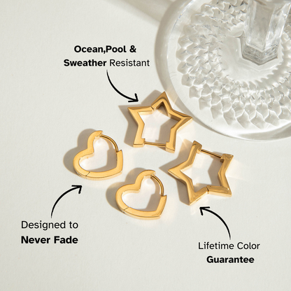 Two pairs of geometric gold hoops — heart and star shaped — photographed in soft natural light