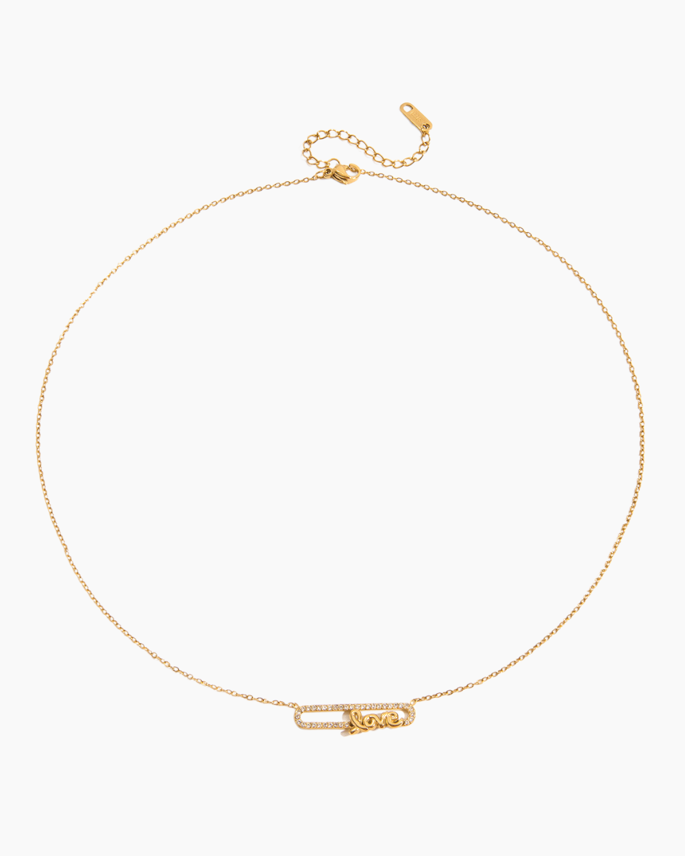 Close-up of gold chain necklace with a dainty LOVE pendant in a safety pin design, displayed on a white background.