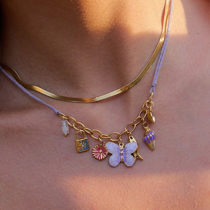 Colorful gold necklace featuring flower and lock charms