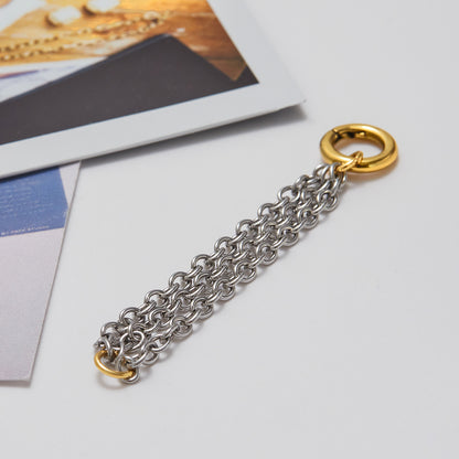 Gold and silver chunky chain ring flat lay on table