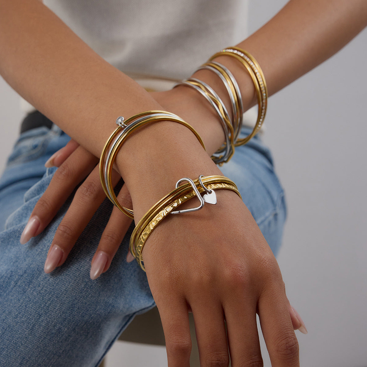 Elegant ripple bracelets on wrist, perfect for everyday stack