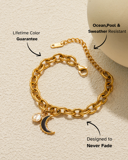Gold chain bracelet with a moon charm on a beige background, featuring text about product features.
