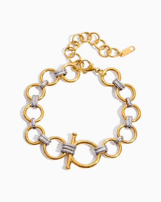 Gold and silver chain bracelet on a white background