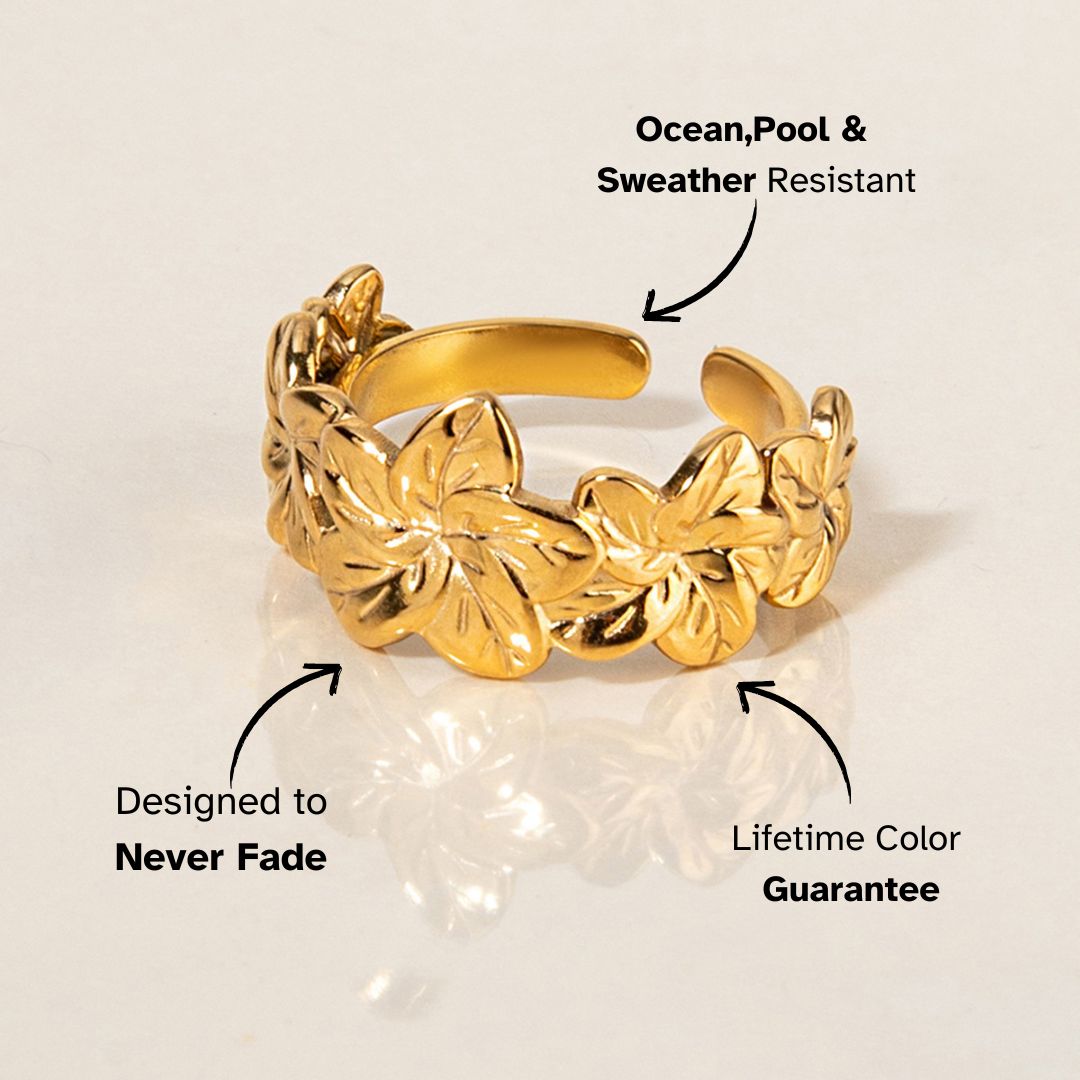 Golden Bloom Cocktail Ring styled on white marble surface, elegant gold plated shine