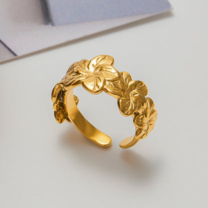 Everyday look with Golden Bloom Everyday Ring matched with stacked bands in minimalist outfit