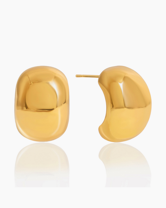 Gold earrings on a white background