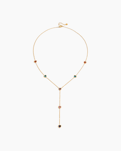 Gold necklace with colorful gemstones on a white background