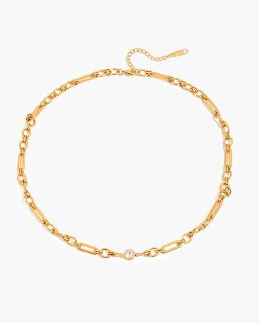 Gold chain necklace on a white background
