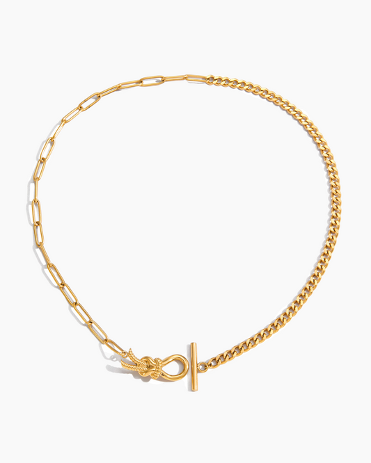 Gold chain necklace with a clasp on a white background