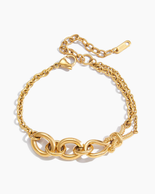 Gold chain bracelet on a white background